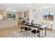 Spacious kitchen with a dining area, modern lighting, and updated appliances create an inviting atmosphere at 5467 W Hinsdale Pl, Littleton, CO 80128