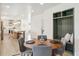 Open-concept kitchen flows into dining area, featuring modern cabinetry and stylish storage at 5467 W Hinsdale Pl, Littleton, CO 80128
