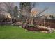 Backyard pond surrounded by rocks and shrubs creating a serene and private outdoor retreat at 5467 W Hinsdale Pl, Littleton, CO 80128