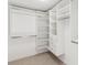 Walk-in closet boasting ample shelving, drawers, and rod space for organization and storage at 5467 W Hinsdale Pl, Littleton, CO 80128