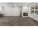 Bright living room with a fireplace and hardwood-style flooring at 1759 Quail St, Lakewood, CO 80215