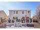 Back exterior showcasing a deck perfect for outdoor dining and relaxation with some snow on the ground at 5232 Creek Way, Parker, CO 80134