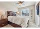 Bedroom with a large window providing natural light and a ceiling fan for comfort at 5232 Creek Way, Parker, CO 80134