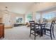 Bright dining room with vaulted ceilings, large windows, and comfortable seating, perfect for gatherings at 5232 Creek Way, Parker, CO 80134