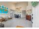 Elegant dining room featuring a decorative chandelier, large windows, and comfortable seating, and vaulted ceilings at 5232 Creek Way, Parker, CO 80134