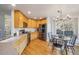 Bright kitchen and eat-in dining area featuring stainless steel appliances, wood floors, and a view to the backyard at 5232 Creek Way, Parker, CO 80134