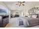 Spacious main bedroom featuring a TV, dresser, desk, and comfortable seating at 5232 Creek Way, Parker, CO 80134