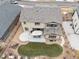 Aerial view of fenced backyard with patio, gravel area, and small lawn at 8035 S Kewaunee St, Aurora, CO 80016