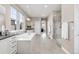 Bright bathroom featuring a soaking tub, a glass-enclosed shower, and double sink vanity at 8035 S Kewaunee St, Aurora, CO 80016