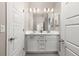 Bathroom featuring a double vanity with bright white cabinets and quartz countertops at 8035 S Kewaunee St, Aurora, CO 80016