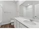 Bathroom with a sink, toilet, shower/tub combo, and mirror at 5710 Ranch St, Mead, CO 80504