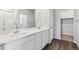 Modern bathroom with double vanity,walk-in shower, and linen closet at 5710 Ranch St, Mead, CO 80504