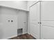 Laundry room with double sliding doors and shelving at 5710 Ranch St, Mead, CO 80504