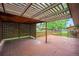 Outdoor deck area with wooden pergola, privacy lattice, and green lawn in background at 8269 Zephyr St, Arvada, CO 80005