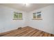 Bright bedroom with hardwood floors and natural light from two windows at 8269 Zephyr St, Arvada, CO 80005