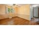 Bedroom featuring hardwood floors, two toned walls, ceiling fan, window and closet at 8269 Zephyr St, Arvada, CO 80005