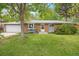 Charming single Gathering home featuring a brick exterior, attached garage, and landscaped yard at 8269 Zephyr St, Arvada, CO 80005