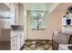 Well-lit kitchen with a cozy breakfast nook and practical layout, making meal preparation a breeze at 6748 S Gallup St, Littleton, CO 80120