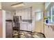 Bright kitchen featuring ample cabinet space and modern appliances, creating an efficient cooking environment at 6748 S Gallup St, Littleton, CO 80120
