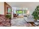 Bright living room filled with natural light and stylish furnishings, offering a comfortable living space at 6748 S Gallup St, Littleton, CO 80120