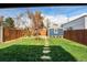Backyard featuring a yard, fence, shed and seating at 3052 S Cherokee St, Englewood, CO 80110