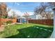 Spacious backyard with a shed, manicured lawn, and a charming patio area perfect for outdoor relaxation at 3052 S Cherokee St, Englewood, CO 80110