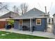 Backyard featuring a patio with seating and grill, a yard and partial fence at 3052 S Cherokee St, Englewood, CO 80110