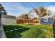 Backyard featuring a yard, shed, fence and seating at 3052 S Cherokee St, Englewood, CO 80110