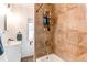 Bathroom featuring a white vanity with a tiled shower and a shower rack at 3052 S Cherokee St, Englewood, CO 80110