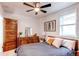 Comfortable bedroom with ceiling fan and ample natural light at 3052 S Cherokee St, Englewood, CO 80110