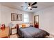 Comfortable bedroom with ceiling fan and ample natural light at 3052 S Cherokee St, Englewood, CO 80110