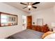 Cozy bedroom features neutral paint, natural light and stylish décor at 3052 S Cherokee St, Englewood, CO 80110