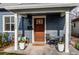 Charming front porch with comfortable seating, decorative plants, and a welcoming entrance at 3052 S Cherokee St, Englewood, CO 80110