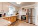 Charming kitchen with stainless steel appliances and white countertops at 3052 S Cherokee St, Englewood, CO 80110