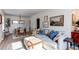 Inviting living room featuring a comfortable couch, natural light, and stylish decor at 3052 S Cherokee St, Englewood, CO 80110