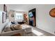Bright living room showcasing a comfortable sectional sofa, fireplace, and natural light at 3052 S Cherokee St, Englewood, CO 80110