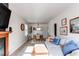 Open concept living area with modern décor, natural light, and a connected dining space at 3052 S Cherokee St, Englewood, CO 80110