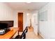 Functional home office space with direct access to a laundry room at 3052 S Cherokee St, Englewood, CO 80110