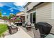 Back patio with hot tub, privacy curtains, and backyard at 11725 Helena St, Commerce City, CO 80022