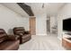 Spacious basement with plush carpeting and dark fixtures, ideal for entertainment at 11725 Helena St, Commerce City, CO 80022