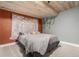 Unique bedroom decor features a plank ceiling, floral tapestry, and accent vines at 11725 Helena St, Commerce City, CO 80022