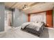 Charming bedroom with a wooden plank ceiling, tapestry wall hanging, and stylish decor at 11725 Helena St, Commerce City, CO 80022