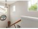 Bright upstairs hallway featuring natural light and decorative touches with views of the neighborhood at 11725 Helena St, Commerce City, CO 80022