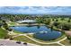 An aerial view of the community featuring a pond, walking paths, and recreation center at 9410 Perry St, Westminster, CO 80031