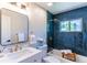 Bathroom with modern fixtures, a tub and shower combination, and decorative tiling at 9410 Perry St, Westminster, CO 80031