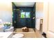 Renovated bathroom featuring a subway tile shower and gold fixtures at 9410 Perry St, Westminster, CO 80031