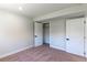 Bedroom boasts natural light, neutral paint, carpet flooring, and a closet at 9410 Perry St, Westminster, CO 80031