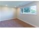 Bedroom featuring neutral paint, carpet flooring, and a large window with lots of natural light at 9410 Perry St, Westminster, CO 80031