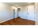 This bedroom has hardwood floors and white trim at 9410 Perry St, Westminster, CO 80031