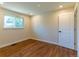 Bedroom with hardwood floors, a bright window, and recessed lights at 9410 Perry St, Westminster, CO 80031